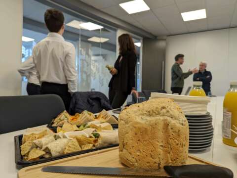 Buffet sandwiches and loaf in an office setting