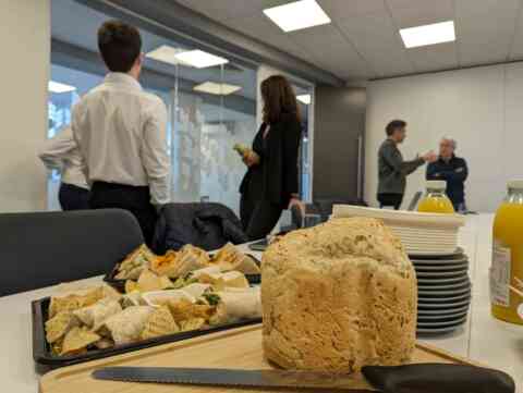 Buffet sandwiches and loaf in an office setting
