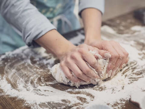 Woman kneading bread dough